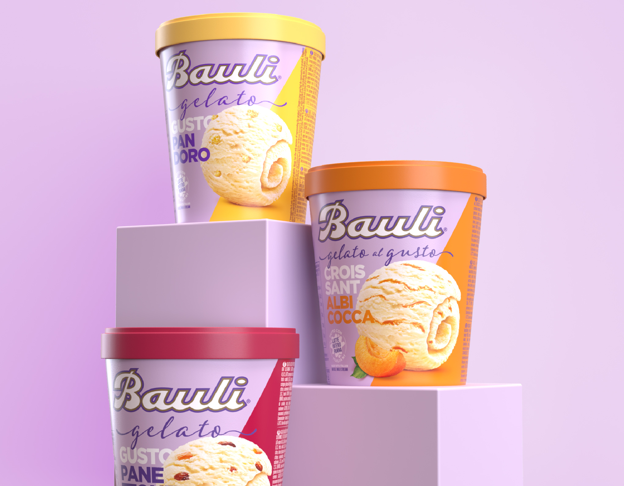 tre barattolini di gelato bauli gusto albicocca, pandoro e panettone posizionati su un piedistallo